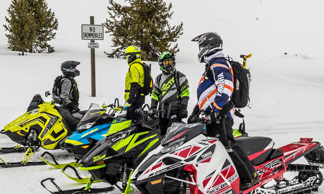 Group of snowmobilers getting ready to ride. 