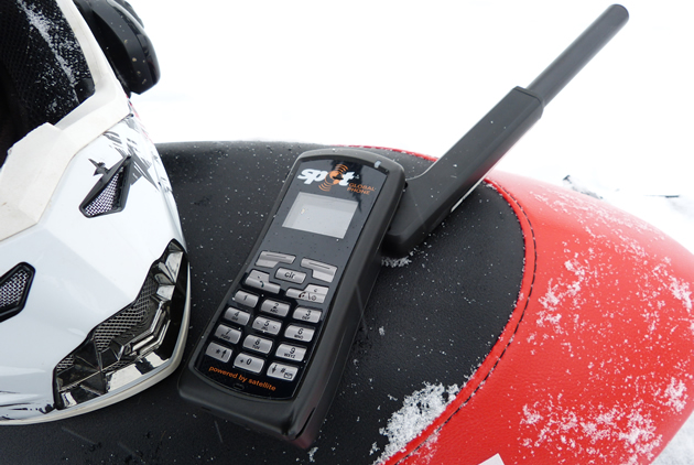 SPOT Global Phone on a snowmobile seat. 