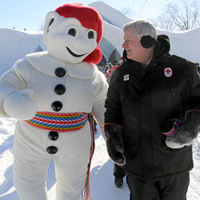 Stephen Harper with the carnival's mascot. 