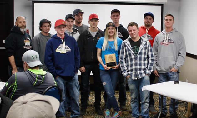 The Stump Humper Squad posing with an award. 