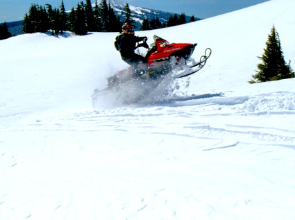 woman riding on a snowmobile