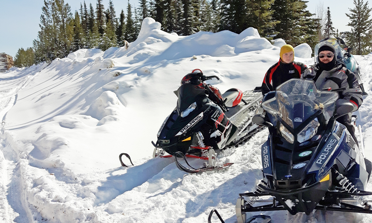 Snowmobilers on the trails near Swan Hills, Alberta.