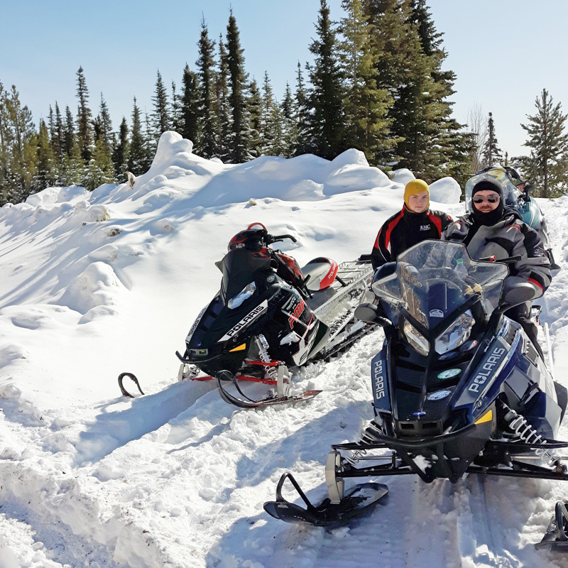 Snowmobilers on the trails near Swan Hills, Alberta.