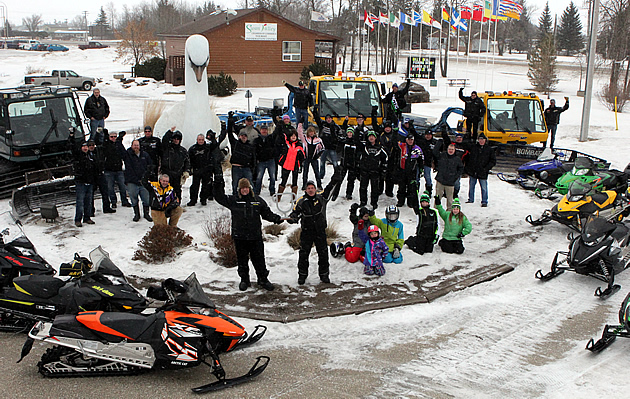 A gathering of snowmobilers in Swan Valley, Manitoba, as they celebrate their 2015 SledTown ShowDown championship. 