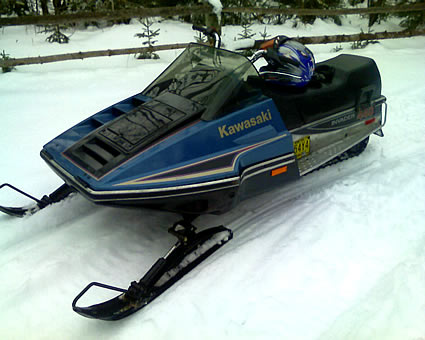 vintage sled in a driveway