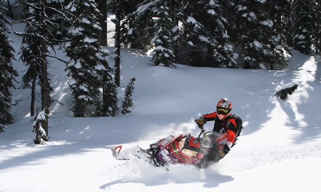 Trish Drinkle trying out her new shocks in the powder. 