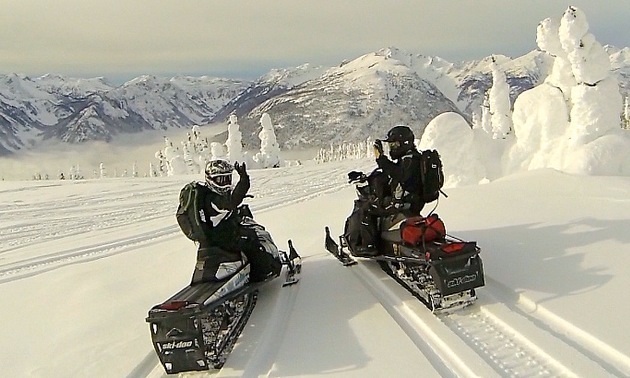 two snowmobiles