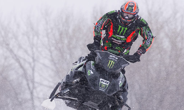 A man on a snowmobile.