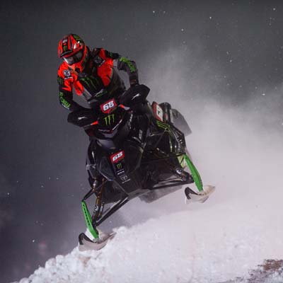 Tucker Hibbert on snowmobile. 