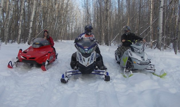 Mark Henderson (left), Cliff Bromberger (middle) and Johnny Kumpula (right) enjoying the powder on the Pembina Drift Busters’ West Loop, Rebecca Bromberger’s choice ride.