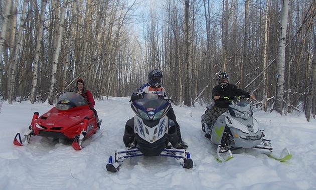 Mark Henderson (left), Cliff Bromberger (middle) and Johnny Kumpula (right) enjoying the powder on the Pembina Drift Busters’ West Loop, Rebecca Bromberger’s choice ride.