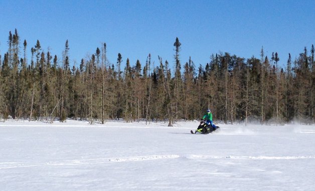 A snowmobiler in Whiteshell Provincial Park in Manitoba.