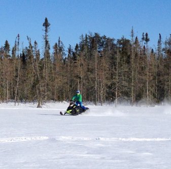 A snowmobiler in Whiteshell Provincial Park in Manitoba.