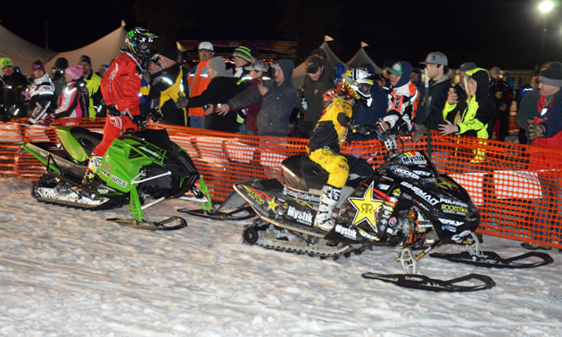 Willie Elam and Colten Moore high fiving the crowd in West Yellowstone. 